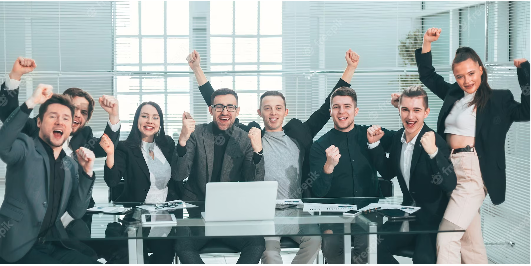 happy employees raising hand